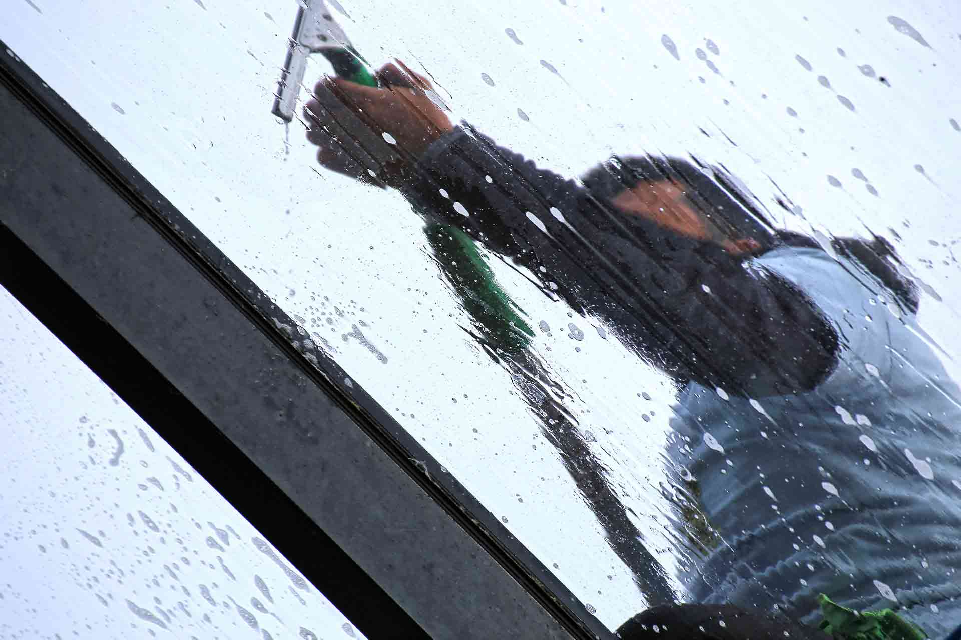 A Man Cleaning Conservatories and glass room